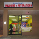 Original Kimberley’s tailoring storefront sign above the shop entrance